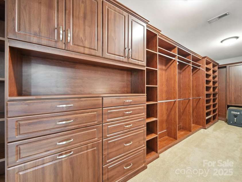 1402 Wynhurst Drive, Waxhaw, NC 28173.  MLS# CAR4290603, YatesRealty ID 32635. Jaw dropping primary closet - this is the left side of this stunning closet!
