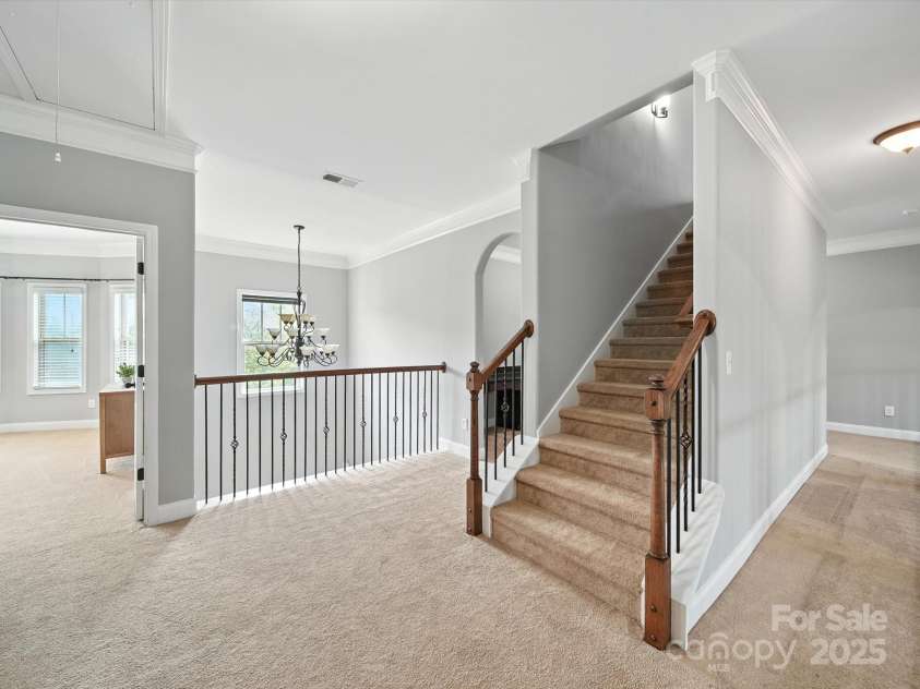1402 Wynhurst Drive, Waxhaw, NC 28173.  MLS# CAR4290603, YatesRealty ID 32635. Landing and stairs to the 3rd level.