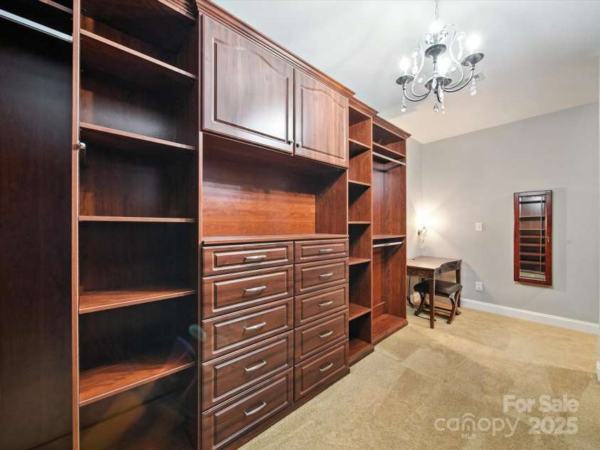 1402 Wynhurst Drive, Waxhaw, NC 28173.  MLS# CAR4290603, YatesRealty ID 32635. Looking back at the right side of the closet with custom seating area.