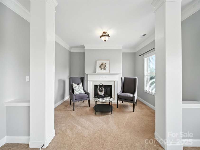 1402 Wynhurst Drive, Waxhaw, NC 28173.  MLS# CAR4290603, YatesRealty ID 32635. Primary bedroom with seating area and gas fireplace.