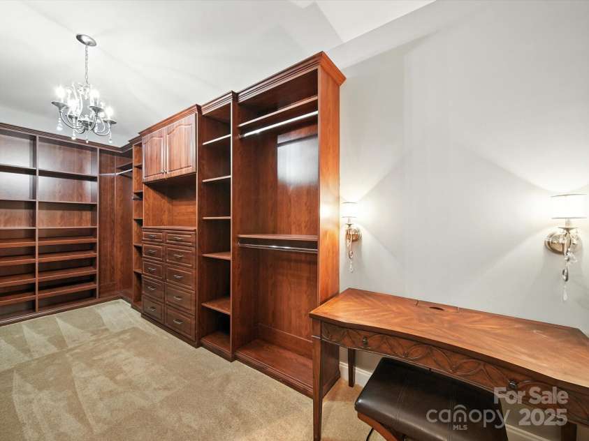 1402 Wynhurst Drive, Waxhaw, NC 28173.  MLS# CAR4290603, YatesRealty ID 32635. Right side of the expansive closet with custom built-ins.