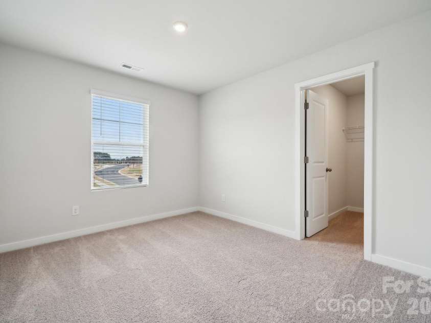 8035 Midas Lane, Locust, NC 28097.  MLS# CAR4388200, YatesRealty ID 32638. Photo is representative