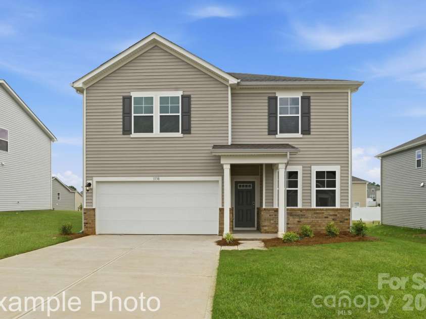 8031 Midas Lane, Locust, NC 28097.  MLS# CAR4387169, YatesRealty ID 32639. Example Photo