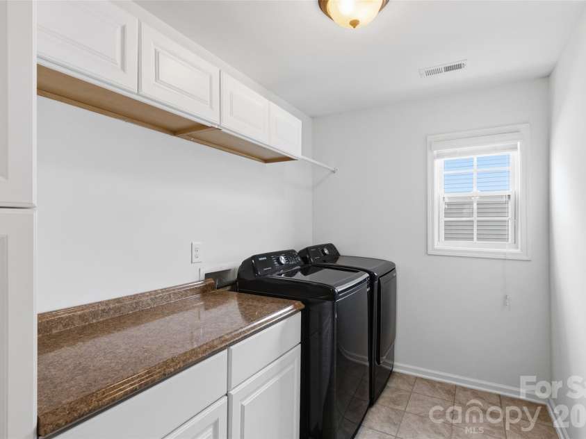 1241 Horsesugar Road, Clover, SC 29710.  MLS# CAR4360140, YatesRealty ID 32643. Convenient Upstairs Laundry with Cabinets and Ample Counter Space