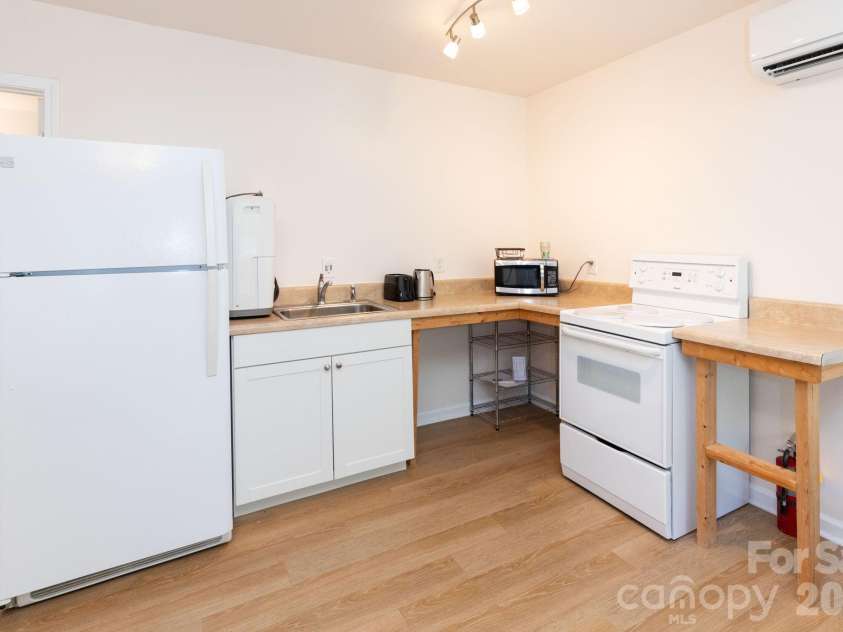 12 Lila Lane, Clyde, NC 28721.  MLS# CAR4377742, YatesRealty ID 32653. Bottom Level Kitchen