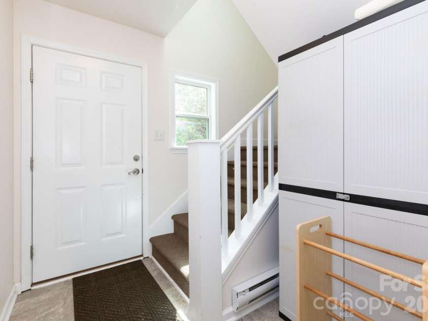 12 Lila Lane, Clyde, NC 28721.  MLS# CAR4377742, YatesRealty ID 32653. Stairs to Upper Level