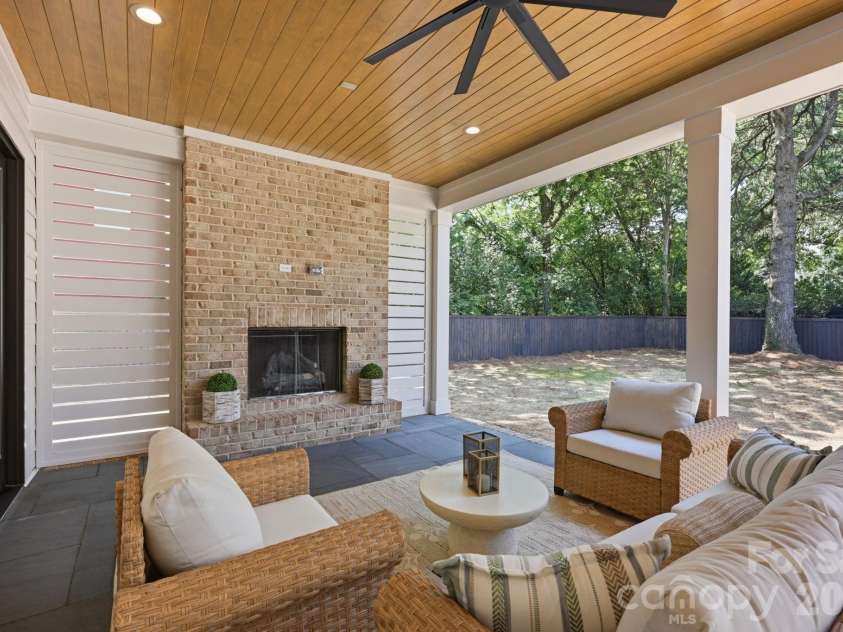 235 Jetton Street, Davidson, NC 28036.  MLS# CAR4391336, YatesRealty ID 32675. Fireplace on rear patio