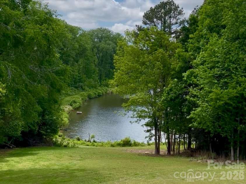 1160 Crestmont Drive, Concord, NC 28025.  MLS# CAR4357365, YatesRealty ID 32681. Beautiful pond view from the condo