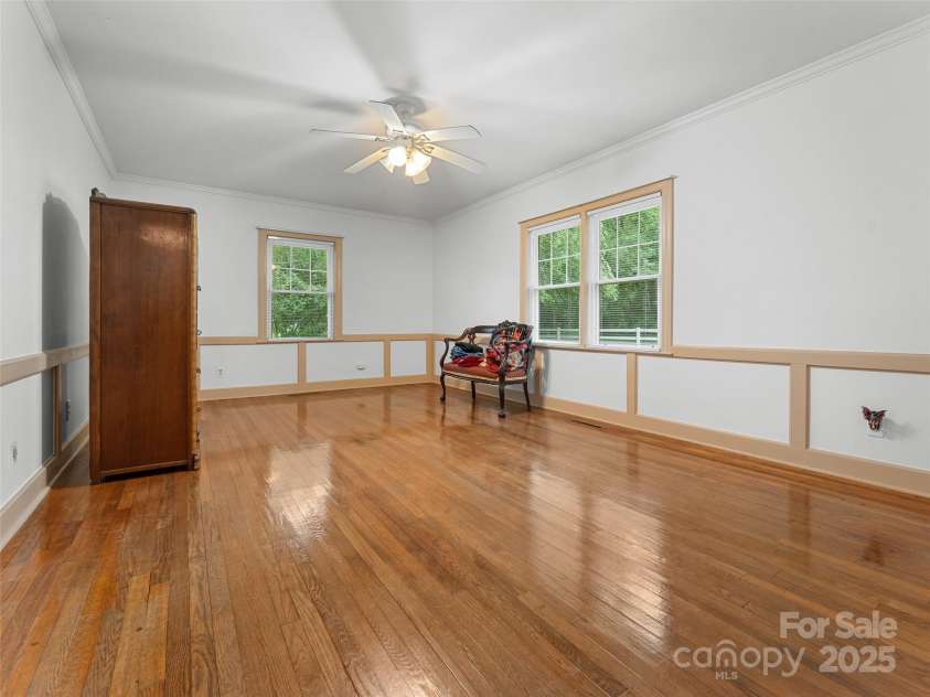 437 Rutledge Drive, Hendersonville, NC 28739.  MLS# CAR4286995, YatesRealty ID 32686. A large bedroom with wonderful hardwood floors.