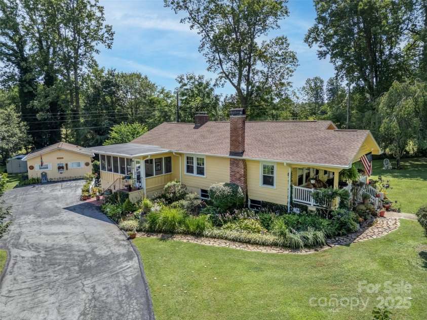437 Rutledge Drive, Hendersonville, NC 28739.  MLS# CAR4286995, YatesRealty ID 32686. Aerial view of the main house with STR 
