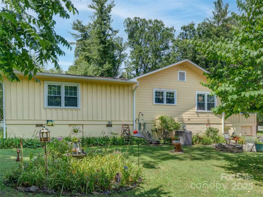 437 Rutledge Drive, Hendersonville, NC 28739.  MLS# CAR4286995, YatesRealty ID 32686. Another backyard view.
