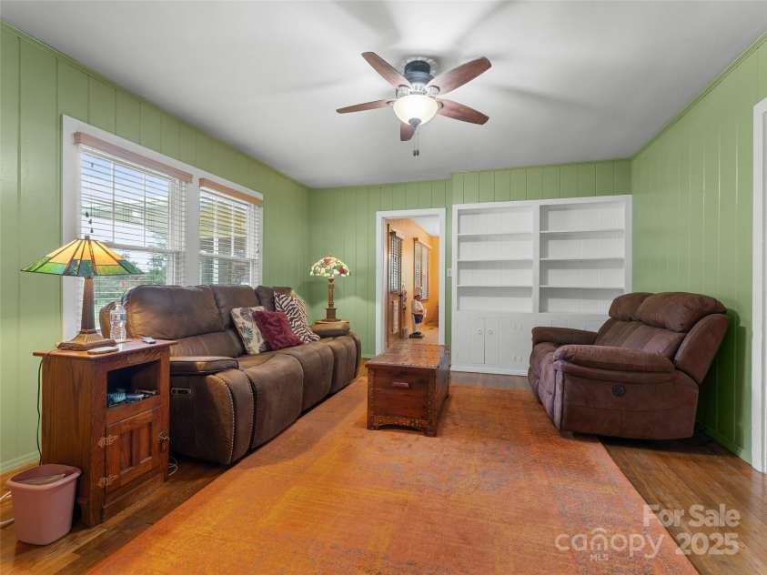 437 Rutledge Drive, Hendersonville, NC 28739.  MLS# CAR4286995, YatesRealty ID 32686. Den with built in bookshelves.