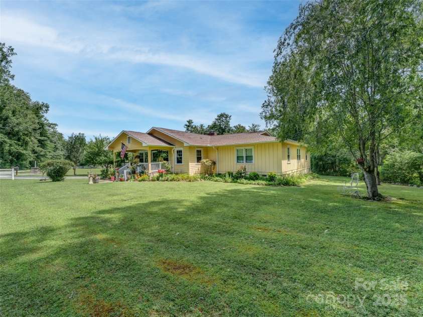 437 Rutledge Drive, Hendersonville, NC 28739.  MLS# CAR4286995, YatesRealty ID 32686. View of the front of the house from the right corner of the property.