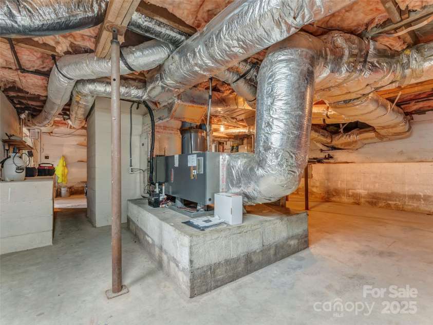 437 Rutledge Drive, Hendersonville, NC 28739.  MLS# CAR4286995, YatesRealty ID 32686. Work area, storage space, clean basement.