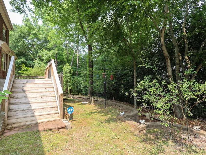 9900 Colvard Circle, Charlotte, NC 28269.  MLS# CAR4264352, YatesRealty ID 32688. Back Yard & Deck steps