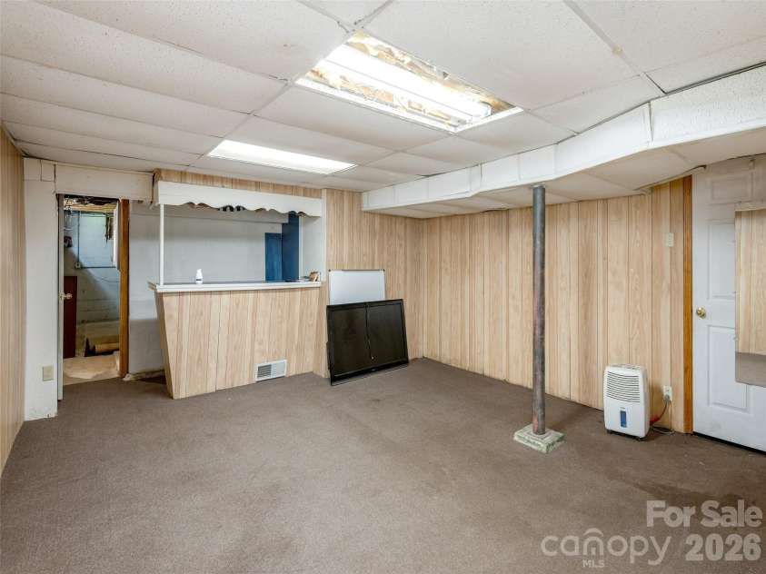 79 Edgewood Drive, Arden, NC 28704.  MLS# CAR4397224, YatesRealty ID 32695. Basement Flex Room