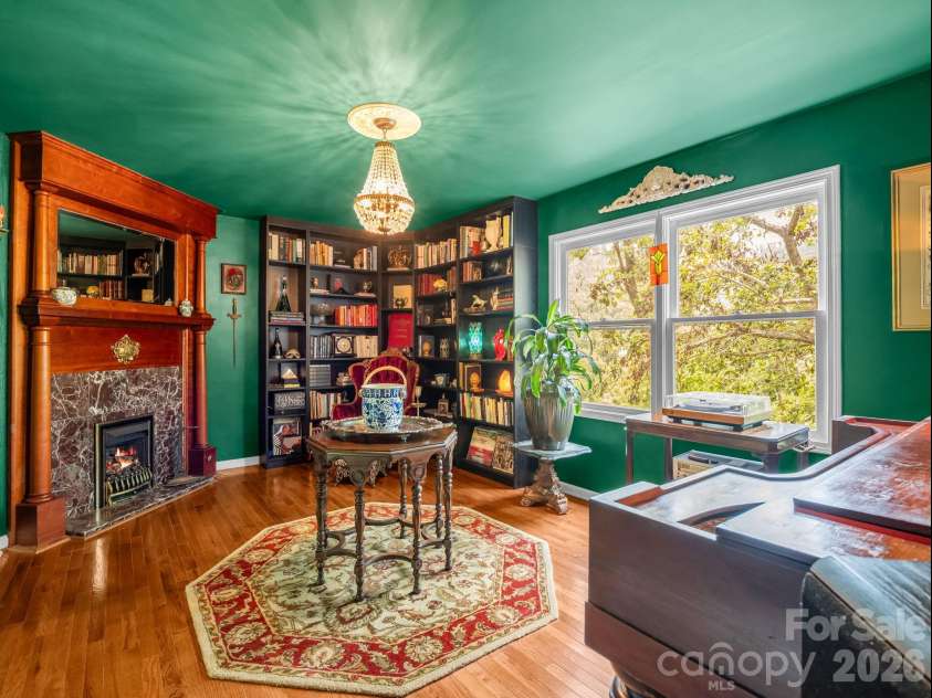 8 Sunny Ridge Drive, Asheville, NC 28804.  MLS# CAR4389104, YatesRealty ID 32706. Such a compelling space with fireplace and large windows