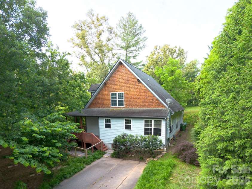 340 Old Haw Creek Road, Asheville, NC 28805.  MLS# CAR4394261, YatesRealty ID 32709. Side elevation and parking area