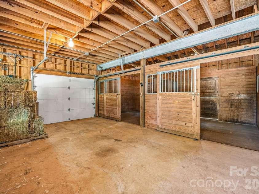 3012 Polk County Line Road, Rutherfordton, NC 28139.  MLS# CAR4394667, YatesRealty ID 32712. 2 of 4 Stalls with Convenient Loading & Unloading Door