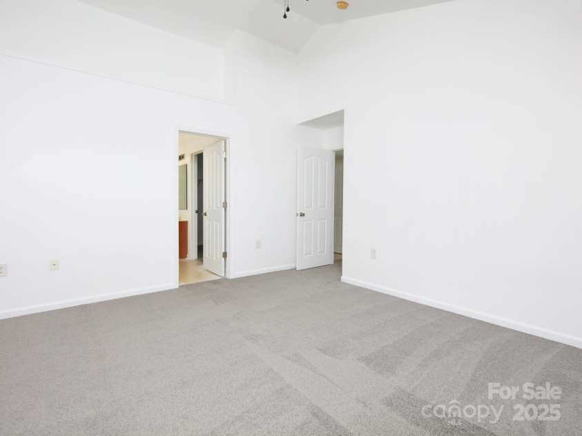 150 Bluffton Road, Mooresville, NC 28115.  MLS# CAR4241722, YatesRealty ID 32717. Enter Primary Bedroom