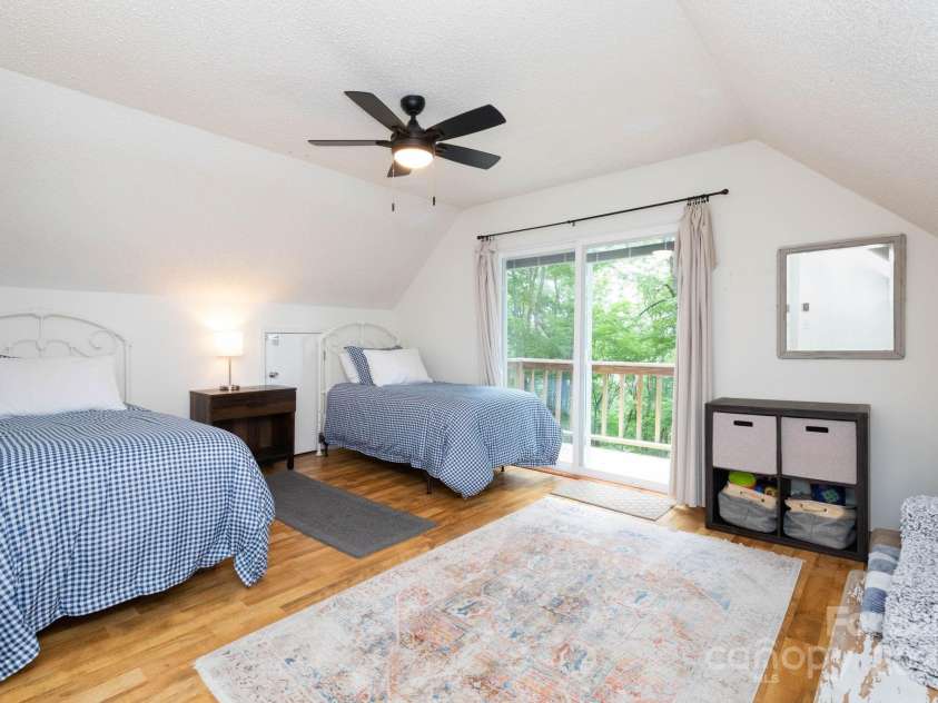 920 McKinney Gap Drive, Mars Hill, NC 28754.  MLS# CAR4277067, YatesRealty ID 32718. Upstairs Bedroom 2 with private deck