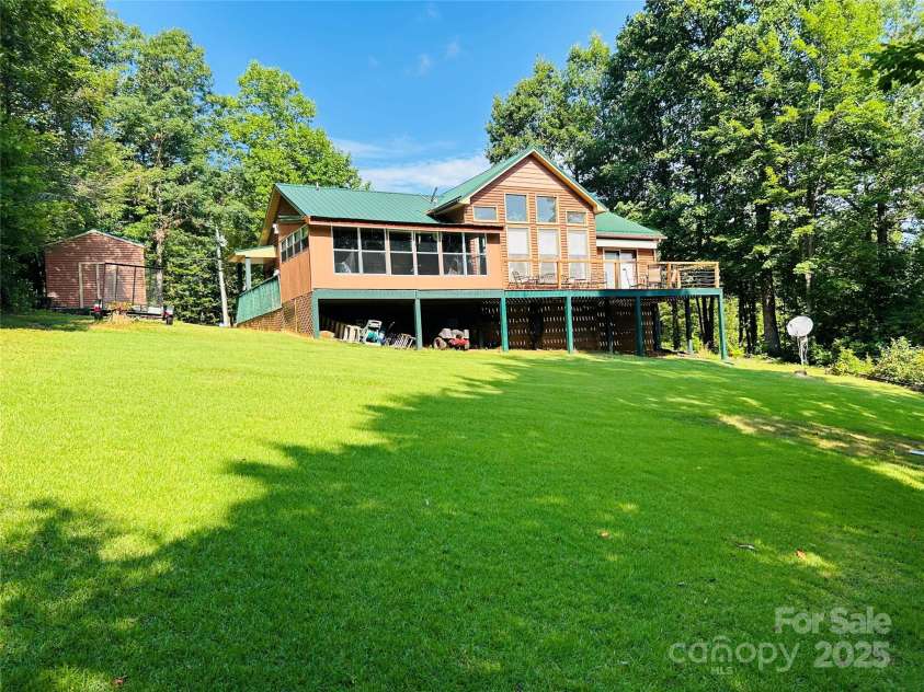 8799 Lisa Trail, Connelly Springs, NC 28612.  MLS# CAR4292879, YatesRealty ID 32719. Back of house with big yard