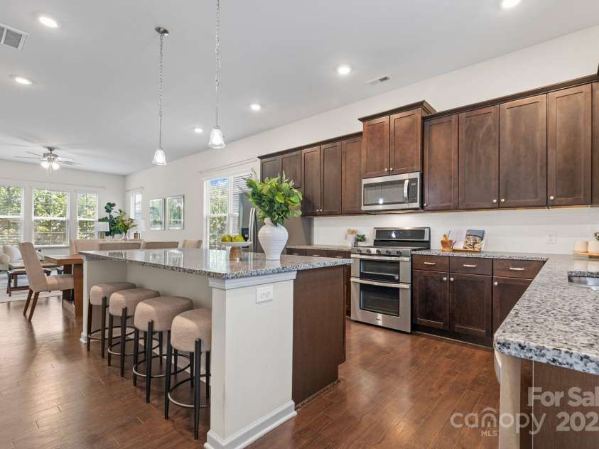 9324 Ainslie Downs Street, Charlotte, NC 28273.  MLS# CAR4276597, YatesRealty ID 32727. Gourmet kitchen with double oven and gas range