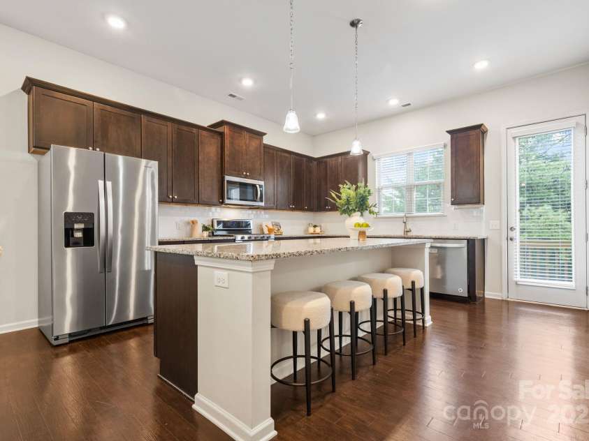 9324 Ainslie Downs Street, Charlotte, NC 28273.  MLS# CAR4276597, YatesRealty ID 32727. Oversized island and balcony off your kitchen