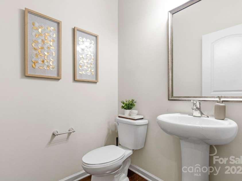 9324 Ainslie Downs Street, Charlotte, NC 28273.  MLS# CAR4276597, YatesRealty ID 32727. Powder bath on living level
