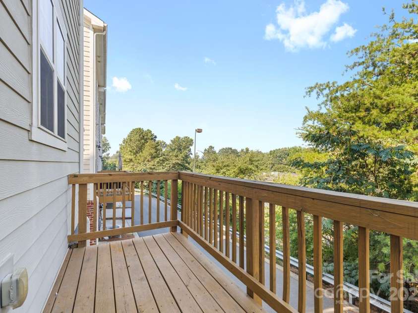 9324 Ainslie Downs Street, Charlotte, NC 28273.  MLS# CAR4276597, YatesRealty ID 32727. Private balcony backing up to trees