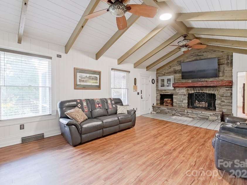 206 Trexler Avenue, Rockwell, NC 28138.  MLS# CAR4198633, YatesRealty ID 3273. The family room features a stone, gas log fireplace and vaulted ceilings.