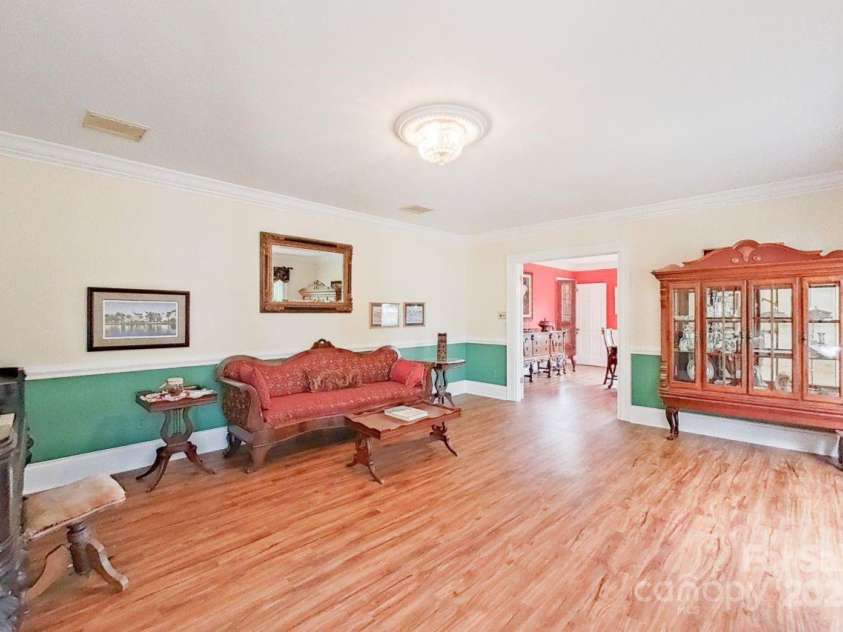 206 Trexler Avenue, Rockwell, NC 28138.  MLS# CAR4198633, YatesRealty ID 3273. The spacious formal living room is adjacent to the formal dining room and allows for entertaining with ease.