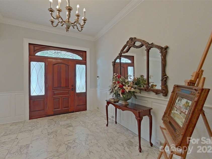 206 Trexler Avenue, Rockwell, NC 28138.  MLS# CAR4198633, YatesRealty ID 3273. This grand foyer has lovely moldings.