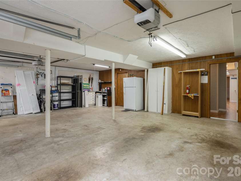615 Goldview Drive, Hendersonville, NC 28791.  MLS# CAR4396945, YatesRealty ID 32735. Garage with workshop space