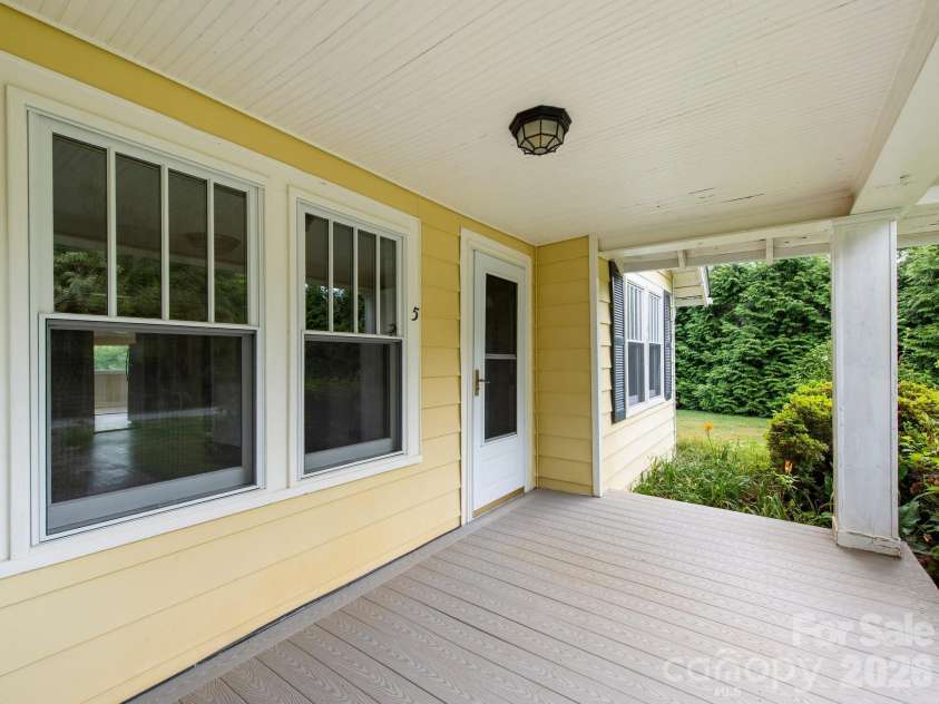 25 Bailey Road, Candler, NC 28715.  MLS# CAR4387001, YatesRealty ID 32736. Front porch