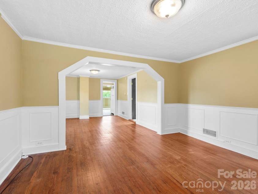 25 Bailey Road, Candler, NC 28715.  MLS# CAR4387001, YatesRealty ID 32736. Living Room into Dining Room