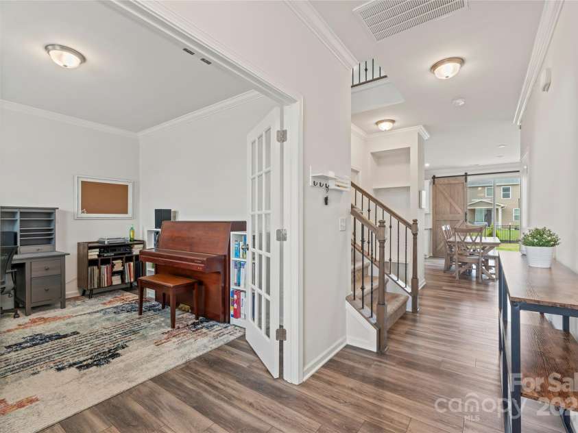 1314 Raelea Drive, Indian Trail, NC 28079.  MLS# CAR4280911, YatesRealty ID 32738. 20ft long foyer opens to the office, half bath and drop zone bench.