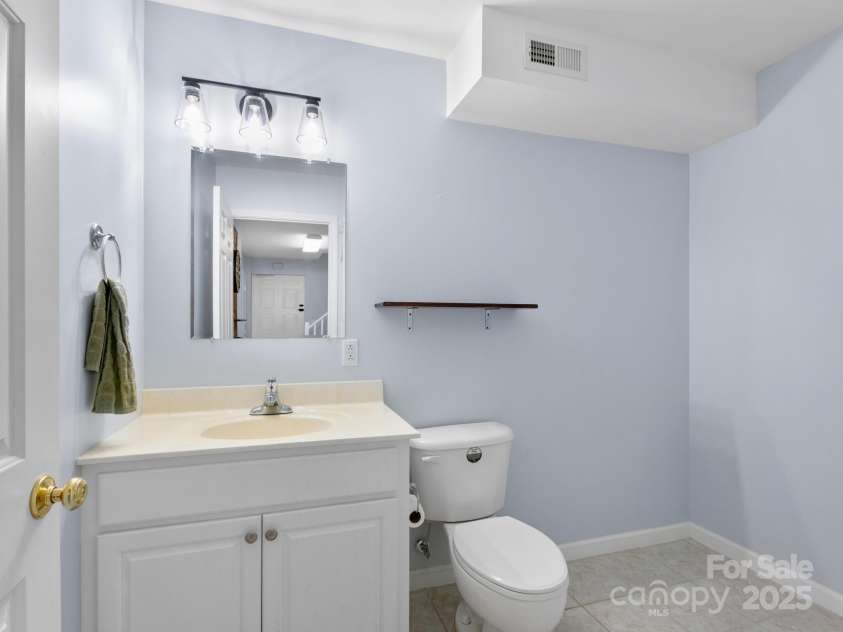 206 Bridle Path, Candler, NC 28715.  MLS# CAR4291478, YatesRealty ID 32755. Half Bath in basement