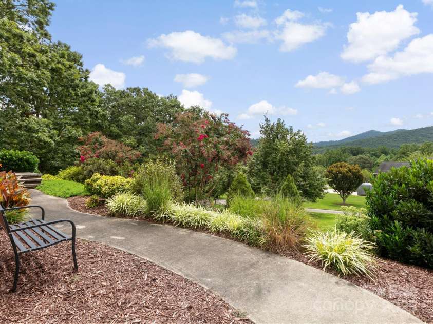 206 Bridle Path, Candler, NC 28715.  MLS# CAR4291478, YatesRealty ID 32755. Walkway to front door 