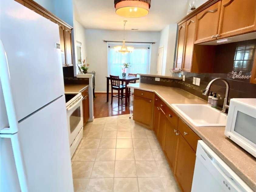 6025 Creft Circle, Indian Trail, NC 28079.  MLS# CAR4387929, YatesRealty ID 32758. Kitchen view into Dining Area.  Countertop microwave.