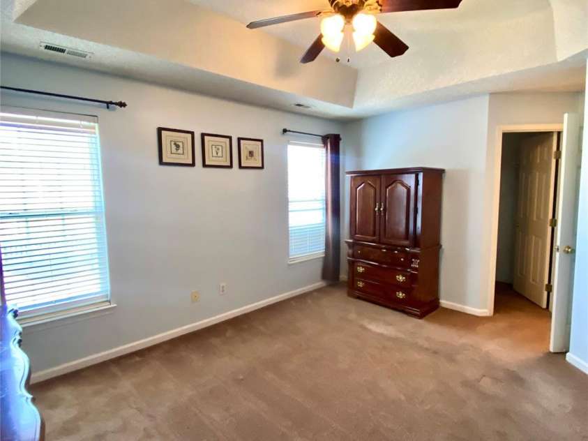 6025 Creft Circle, Indian Trail, NC 28079.  MLS# CAR4387929, YatesRealty ID 32758. Primary Bedroom with tray ceiling and ceiling light/fan.