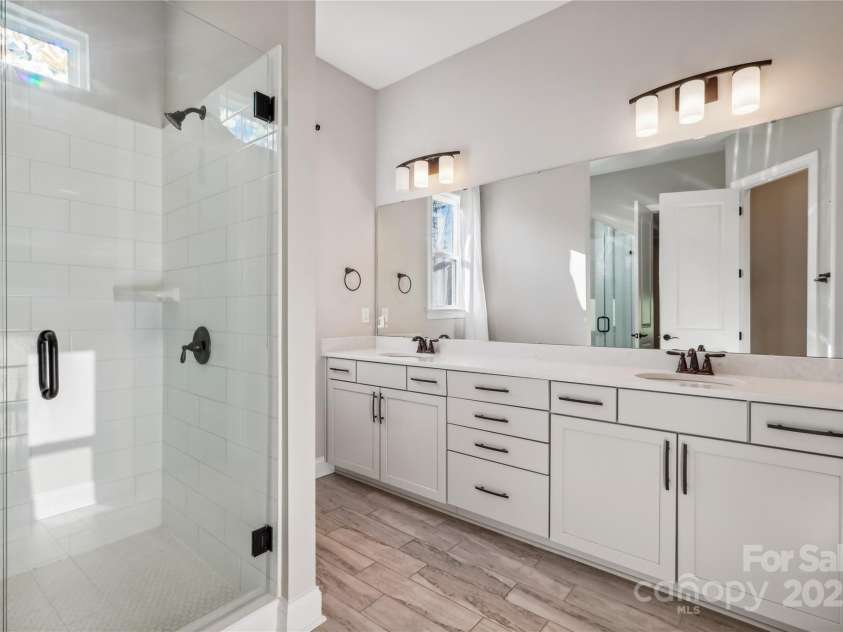 16004 Deer River Road, Charlotte, NC 28278.  MLS# CAR4171564, YatesRealty ID 3276. Alternate angle of primary bath adjoins a private comode and exits to primary bedroom and large walk in closet