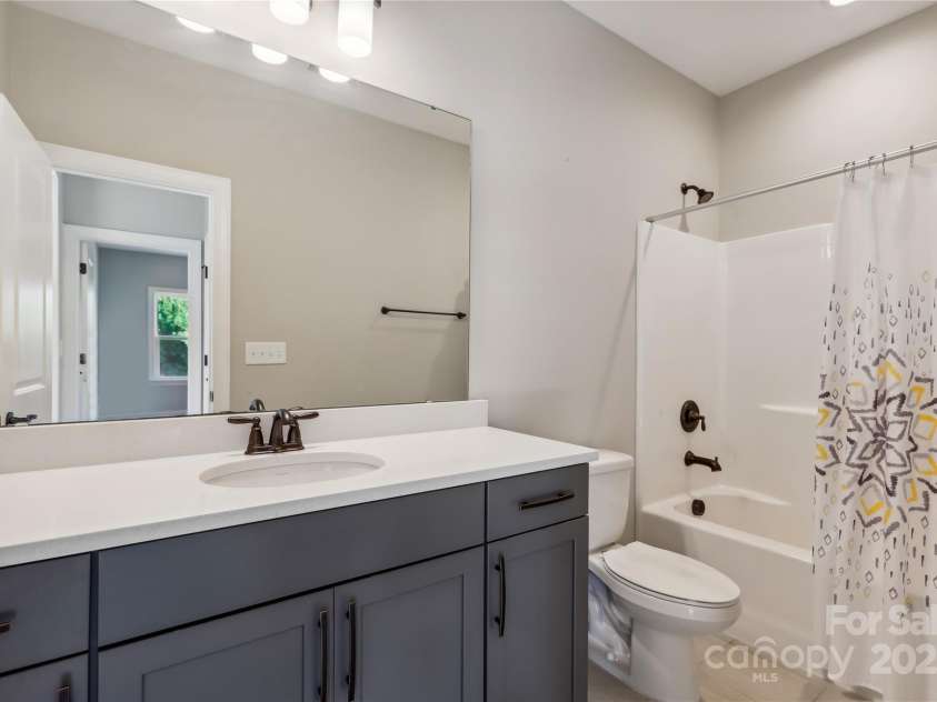 16004 Deer River Road, Charlotte, NC 28278.  MLS# CAR4171564, YatesRealty ID 3276. Digitally StagedUpstairs  3rd bedroom/guest space/reading room digitally staged as den