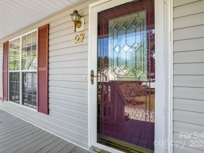 27 Eden Glen Road, Black Mountain, NC 28711.  MLS# CAR4292054, YatesRealty ID 3277. An entryway that says 