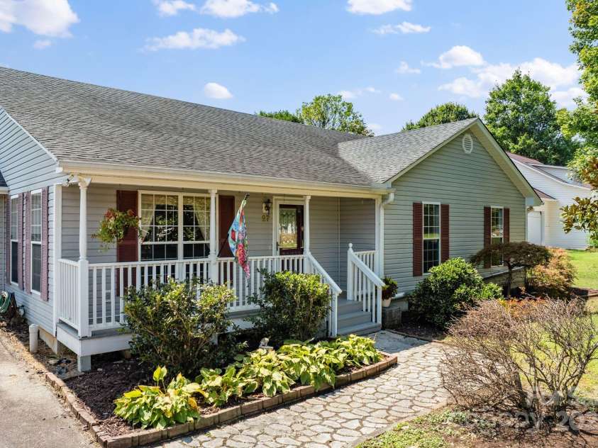 27 Eden Glen Road, Black Mountain, NC 28711.  MLS# CAR4292054, YatesRealty ID 3277. Charming front porch living This inviting home welcomes you with beautiful landscaping, a cozy rocking chair porch, and plenty of curb appeal.