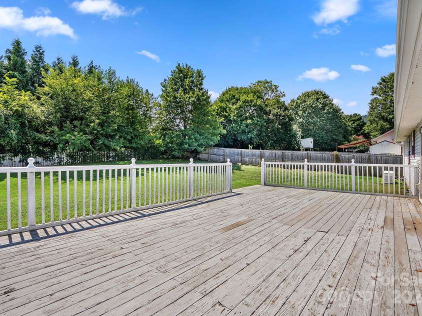 27 Eden Glen Road, Black Mountain, NC 28711.  MLS# CAR4292054, YatesRealty ID 3277. Enjoy outdoor living at its best—spacious deck and private fenced yard.