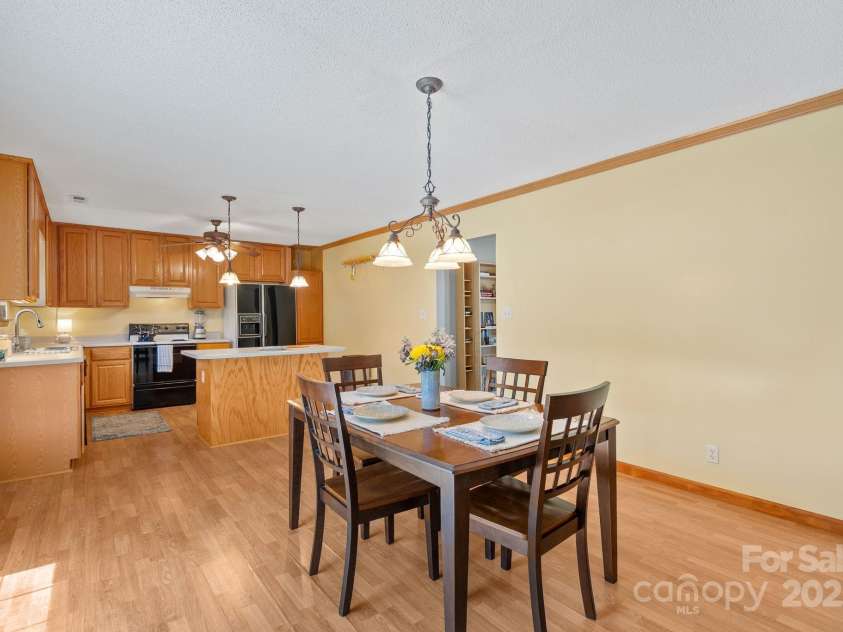 27 Eden Glen Road, Black Mountain, NC 28711.  MLS# CAR4292054, YatesRealty ID 3277. Open dining area flows seamlessly into the kitchen—perfect for family meals and entertaining.