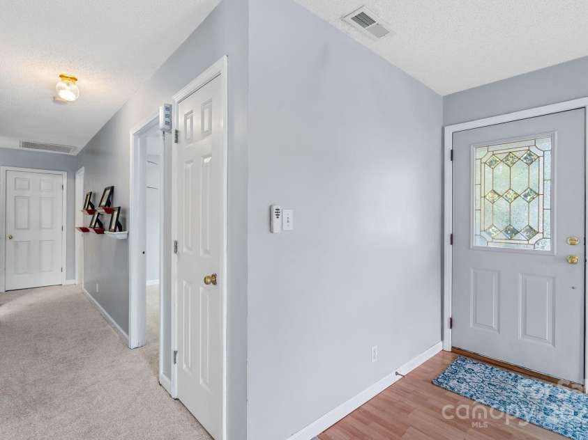 27 Eden Glen Road, Black Mountain, NC 28711.  MLS# CAR4292054, YatesRealty ID 3277. Spacious foyer with decorative glass detail and access to the main living spaces.