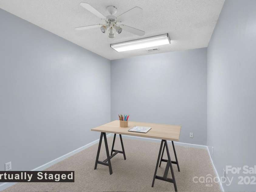 27 Eden Glen Road, Black Mountain, NC 28711.  MLS# CAR4292054, YatesRealty ID 3277. This flexible room is perfect for your lifestyle—set it up as a bright craft or hobby space, home office, or easily convert it into a cozy guest bedroom when visitors come to stay. Fresh carpet, neutral colors, and g