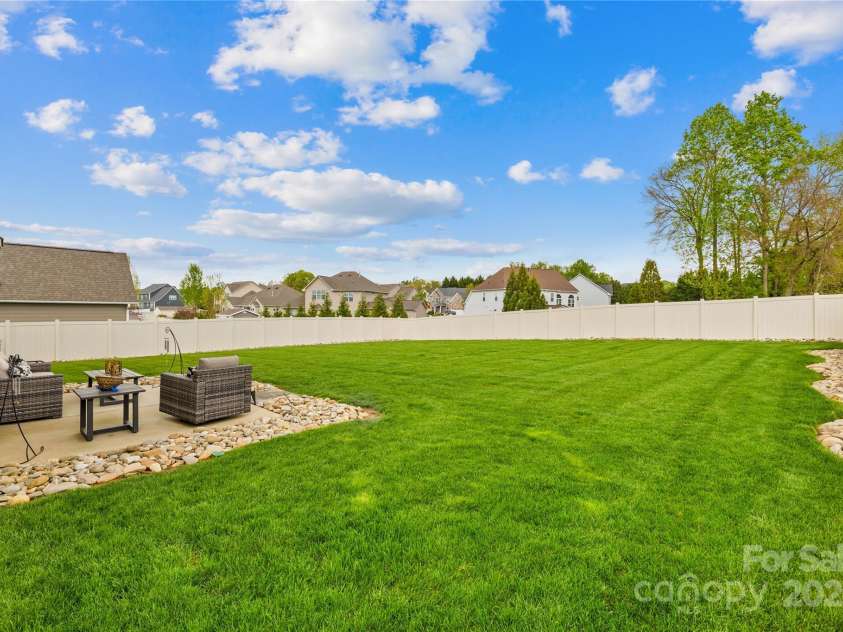 963 Brookdale Lane, Stanley, NC 28164.  MLS# CAR4234265, YatesRealty ID 32771. Fully fenced back yard, plenty of room for a pool, Pergola with outdoor kitchen.